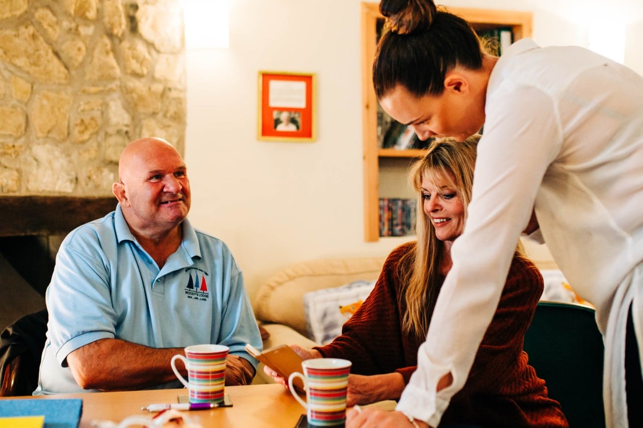 Photo of our volunteers having a chat with a veteran